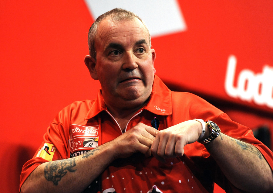 Phil Taylor gesticulates to the crowd