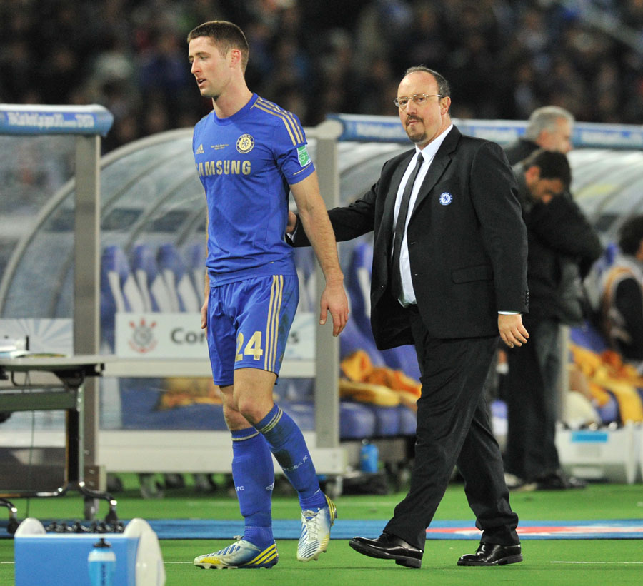 Gary Cahill leaves after a red card as Rafael Benitez greets him