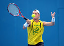Lleyton Hewitt stretches for a forehand