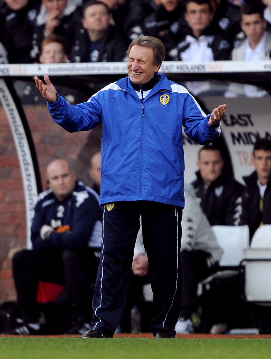 Neil Warnock gestures from the touchline