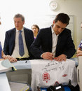 Roy Hodgson and Gary Neville sign a shirt for the nurses
