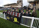 Racegoers display a banner opposing the closure of Folkestone 