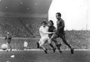 Alan Clarke (left) of Leeds United takes a shot at the Chelsea goal