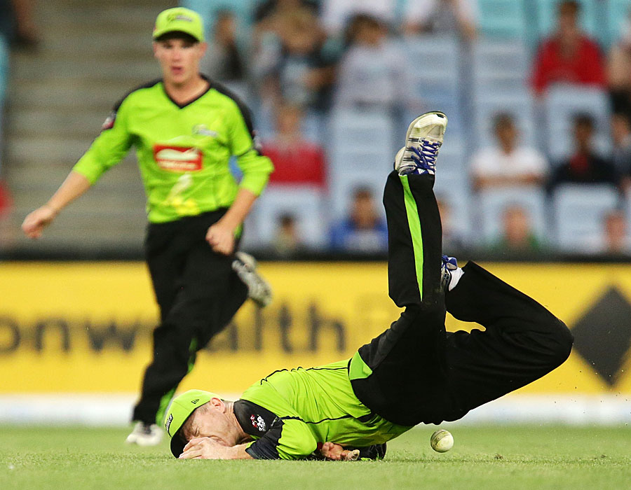 Chris Rogers tumbles onto the ground after missing a catch