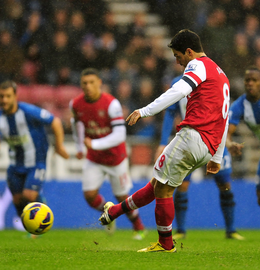 Mikel Arteta slots home from the penalty spot