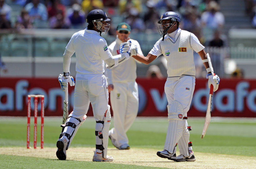 Kumar Sangakkara celebrates reaching 10,000 Test runs