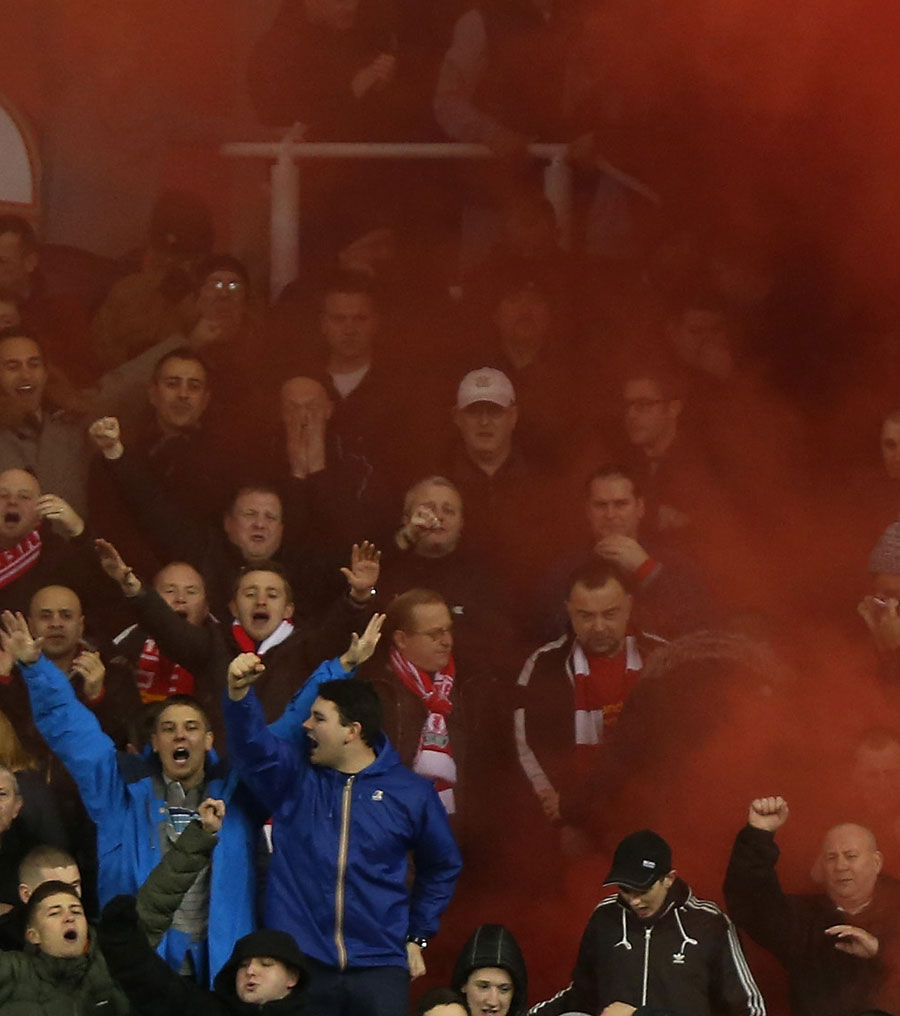 Liverpool fans release a smoke bomb as they celebrate Steven Gerrard's opening goal