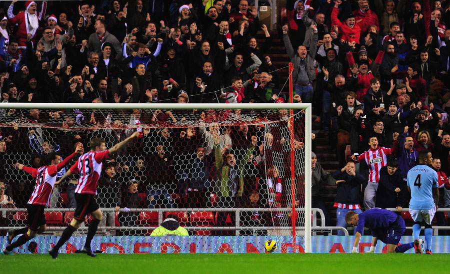 Sunderland's players celebrate Adam Johnson's goal as Joe Hart rues his mistake