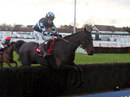 Menorah, ridden by Richard Johnson, clears a fence in the Peterborough Chase