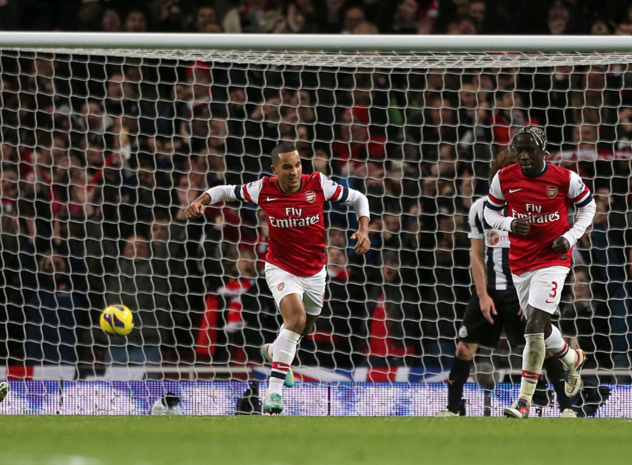 Theo Walcott celebrates scoring Arsenal's fourth goal