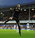 Luis Suarez leaps into the air after scoring