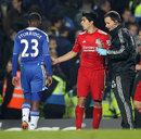 Daniel Sturridge looks sad as he passes Luis Suarez