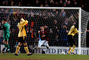 Burnley players celebrate as Djimi Traore puts the ball into his own net