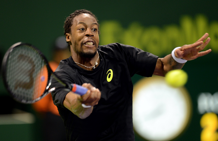 Gael Monfils stretches for a forehand