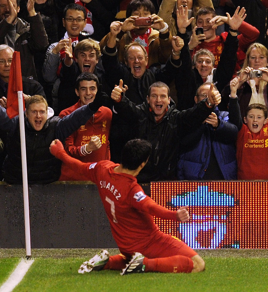 Luis Suarez celebrates in front of the fans