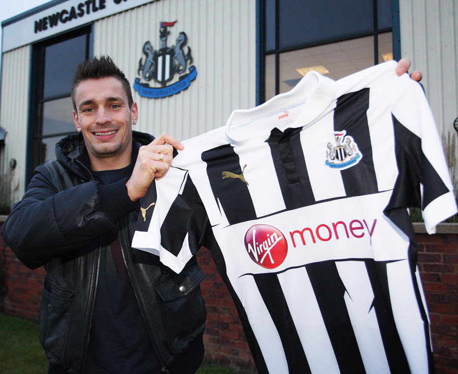 Mathieu Debuchy poses after signing for Newcastle
