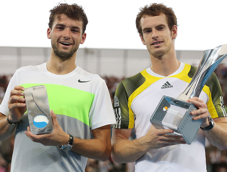 Andy Murray holds the trophy alongside Grigor Dimitrov