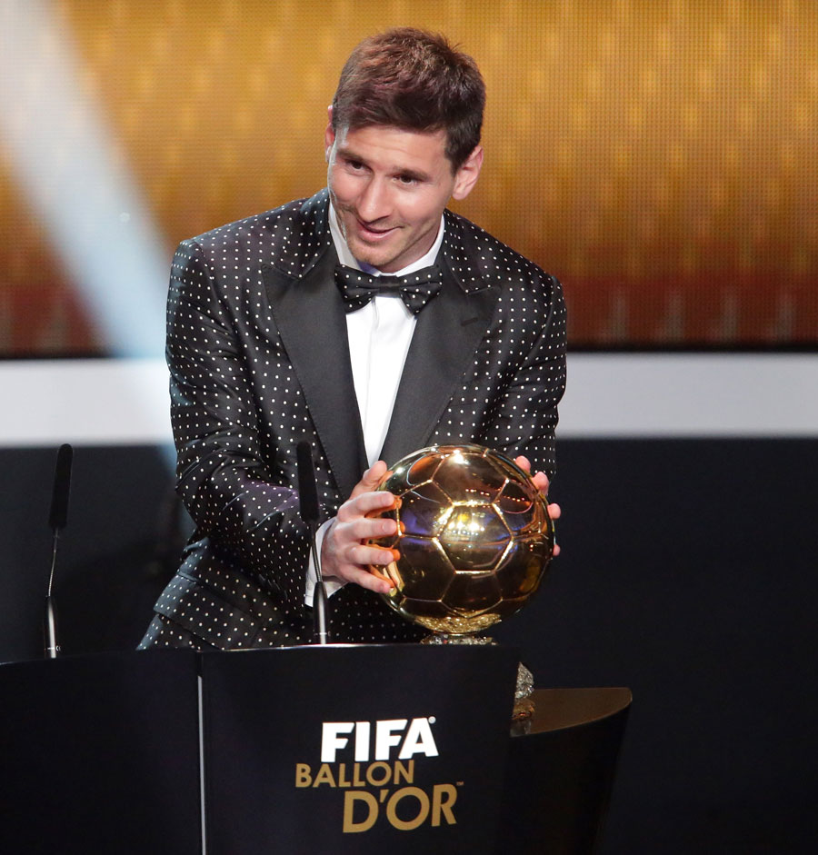 Lionel Messi gets his hands on the FIFA Ballon d'Or for a fourth successive year