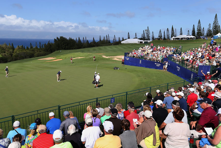 Crowds watch the action at the ninth green