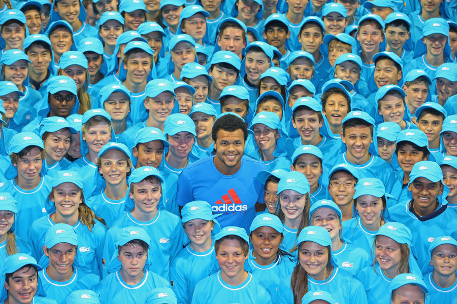 Jo-Wilfried Tsonga poses with the Australian Open ball kids