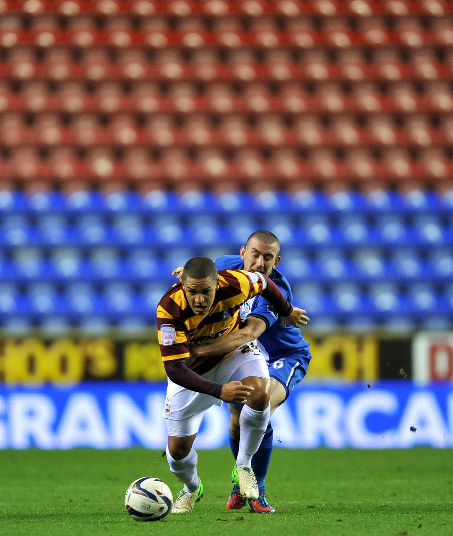 Bradford City's Nathan Doyle chases the ball against Wigan