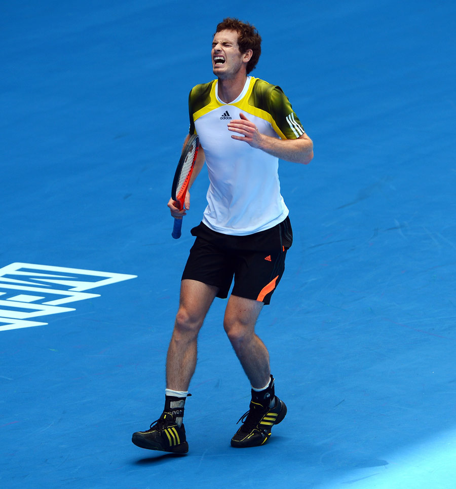 Andy Murray reacts after taking an awkward step