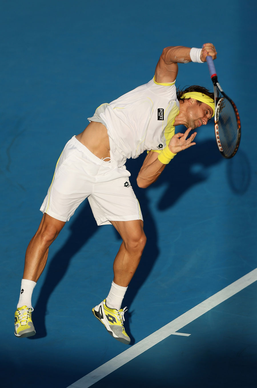David Ferrer of Spain serves in his second round match