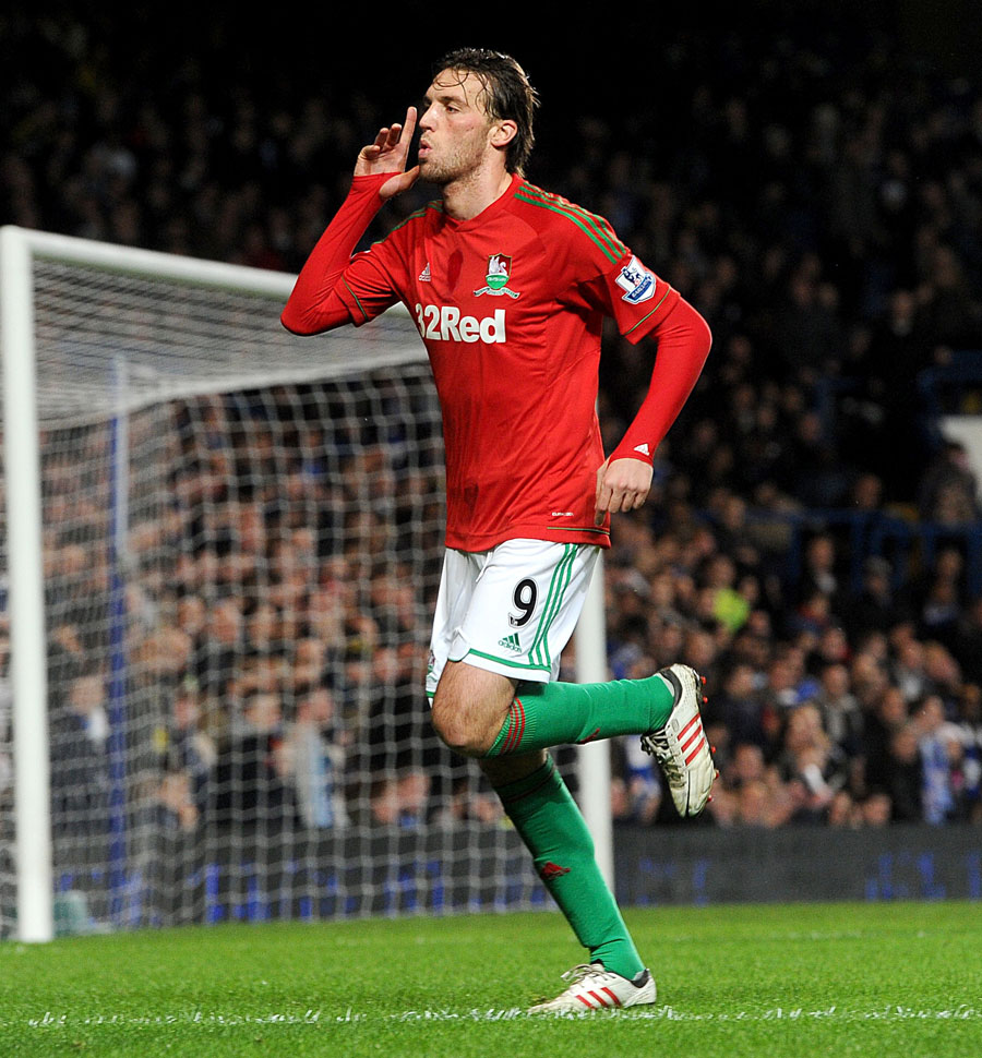 Michu celebrates scoring his side's first goal of the game