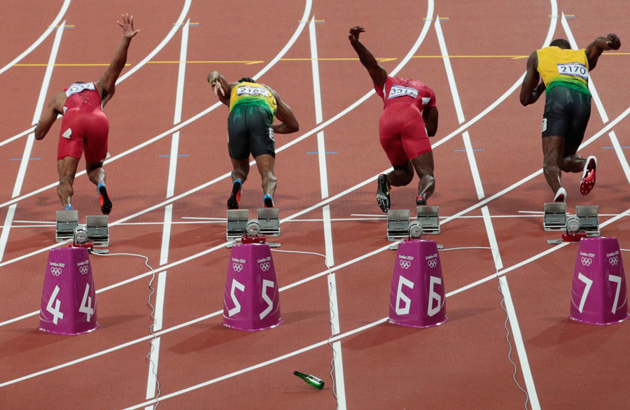 A bottle is thrown onto the track at the start of the men's 100m final