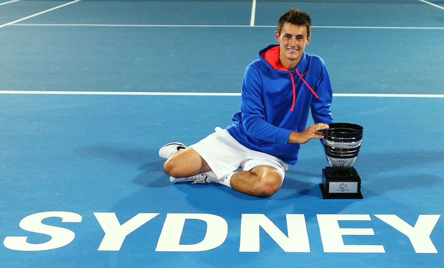 Bernard Tomic poses with his new trophy