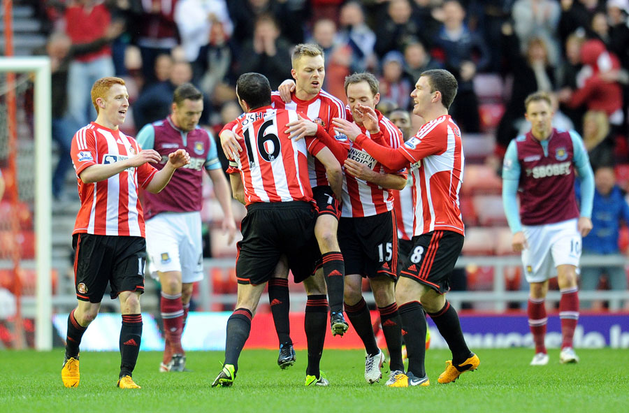 Sebastian Larsson is lifted up by team-mates after scoring