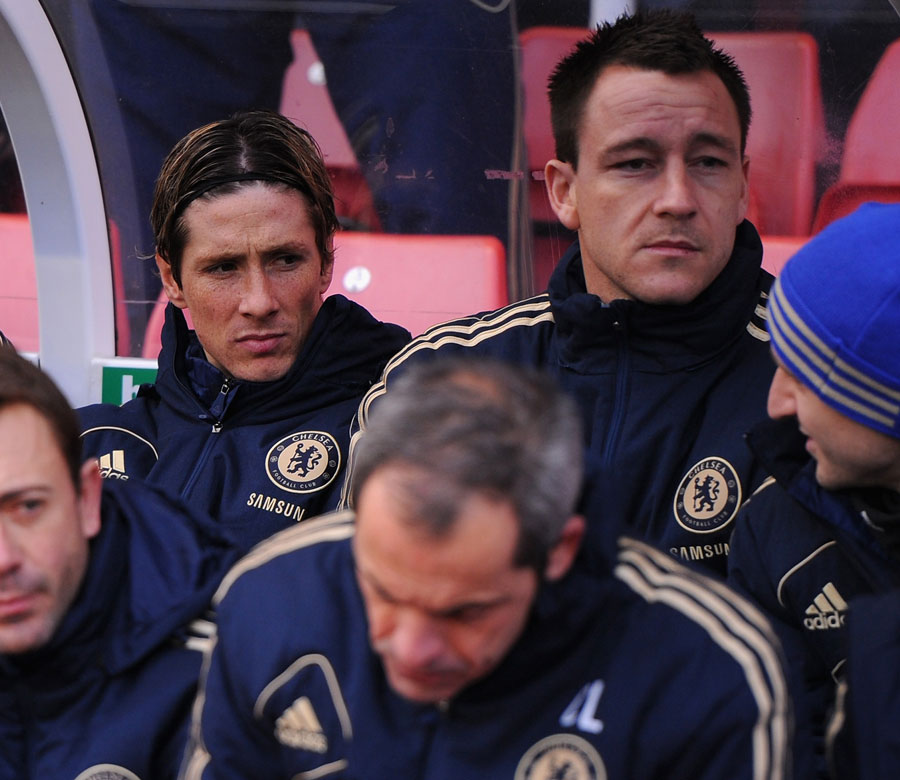 Fernando Torres and John Terry look on from the bench