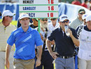 Russell Henley and Scott Langley walk to the 12th tee