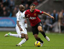 Ryan Giggs and Dwight Tiendalli battle for the ball