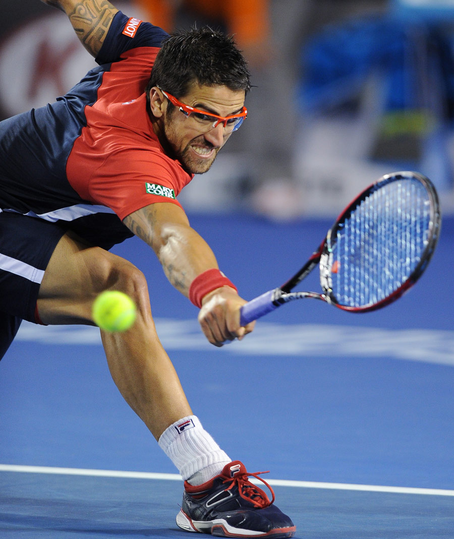 Janko Tipsarevic stretches for a backhand
