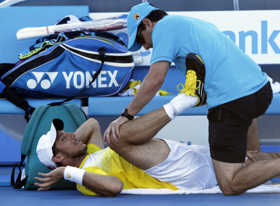 Juan Monaco receives treatment from the trainer
