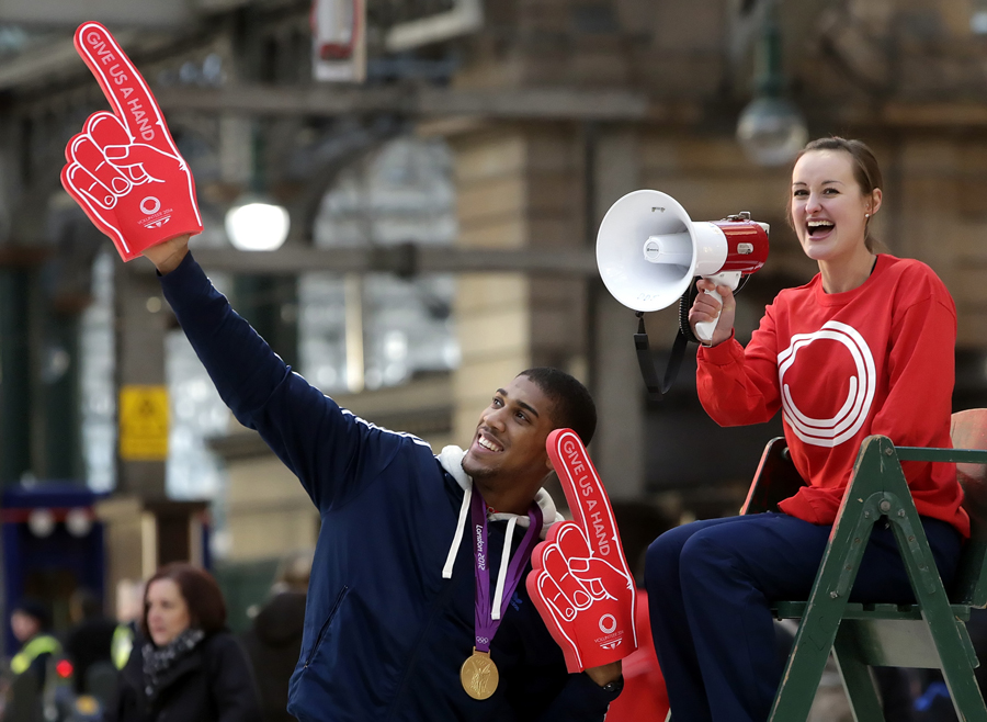 Olympic gold medallist Anthony Joshua and Olympic badminton player Susan Egelstaff pose