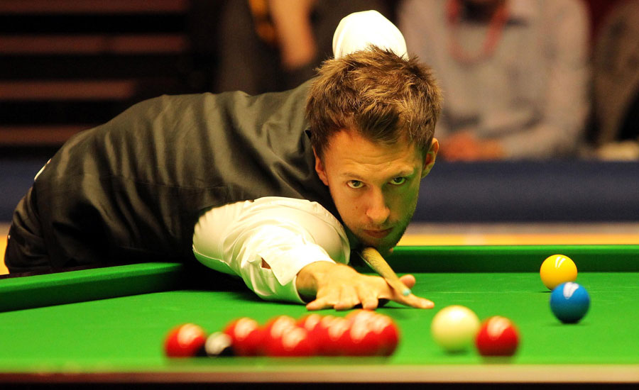 Judd Trump in action against Barry Hawkins