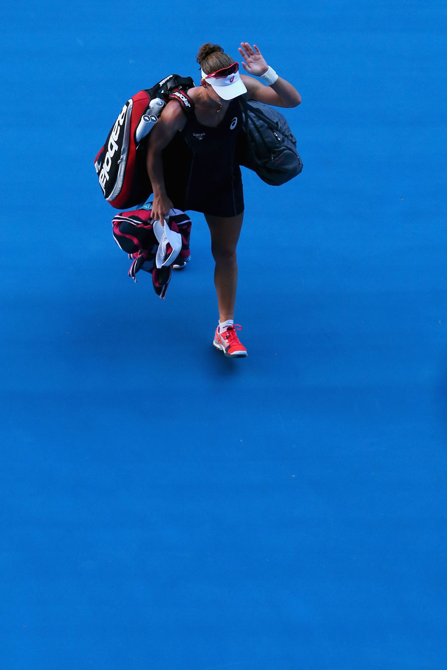 Sam Stosur waves goodbye to fans following her defeat