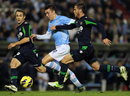 Iago Aspas, centre, vies for space with Real Betis defenders