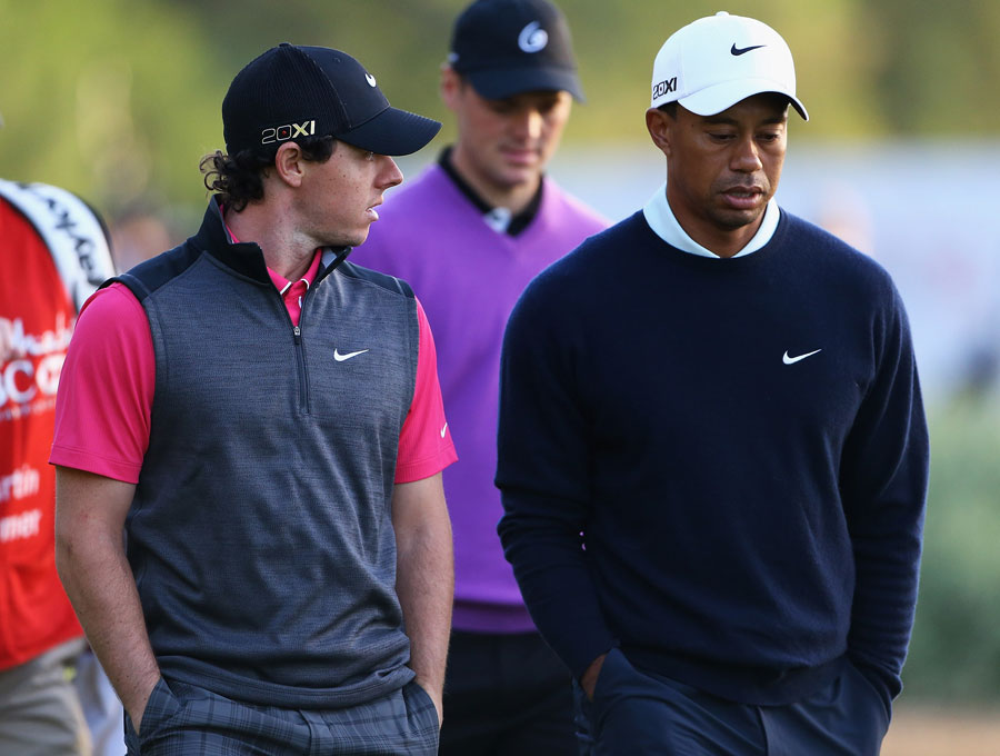 Rory McIlroy and Tiger Woods walk down the 10th fairway 