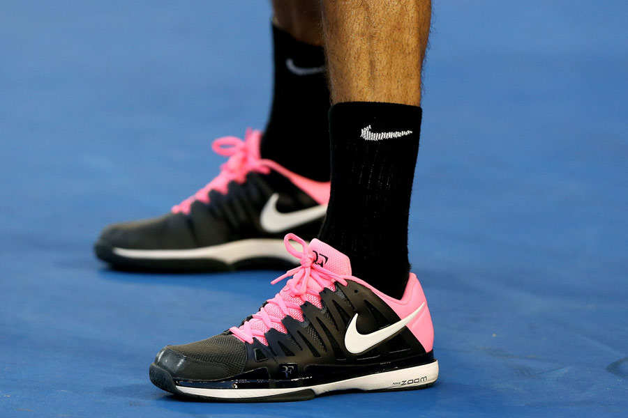 The camera zooms in on Roger Federer's shoes