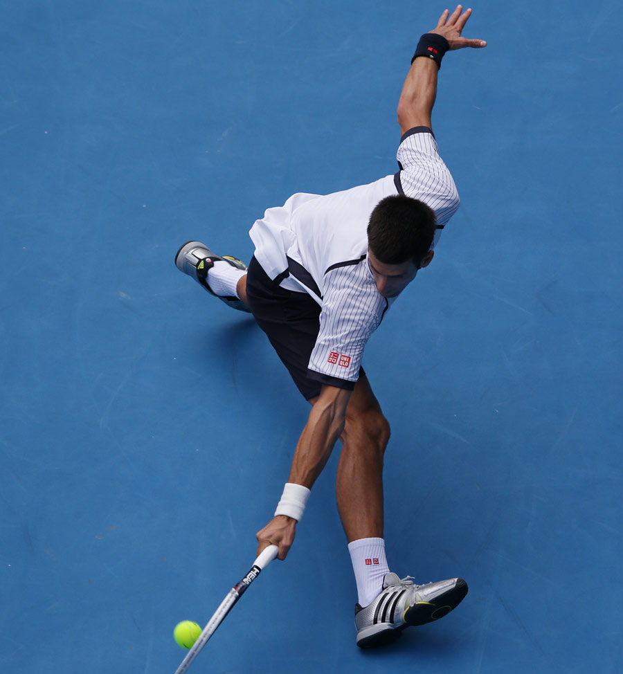 Novak Djokovic flicks a backhand