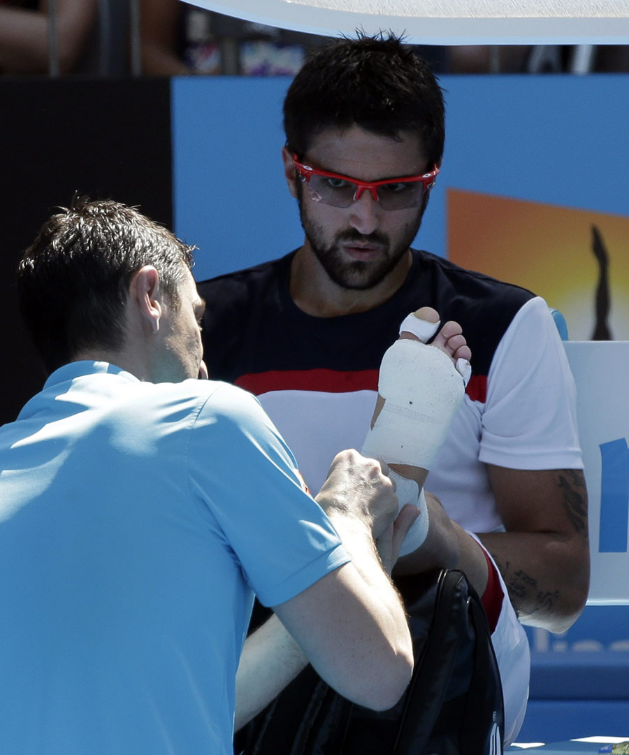 Janko Tipsarevic receives treatment on his foot
