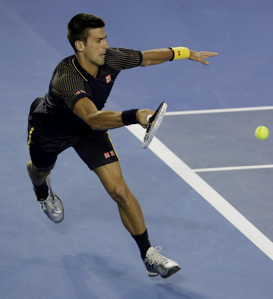 Novak Djokovic stretches for a forehand