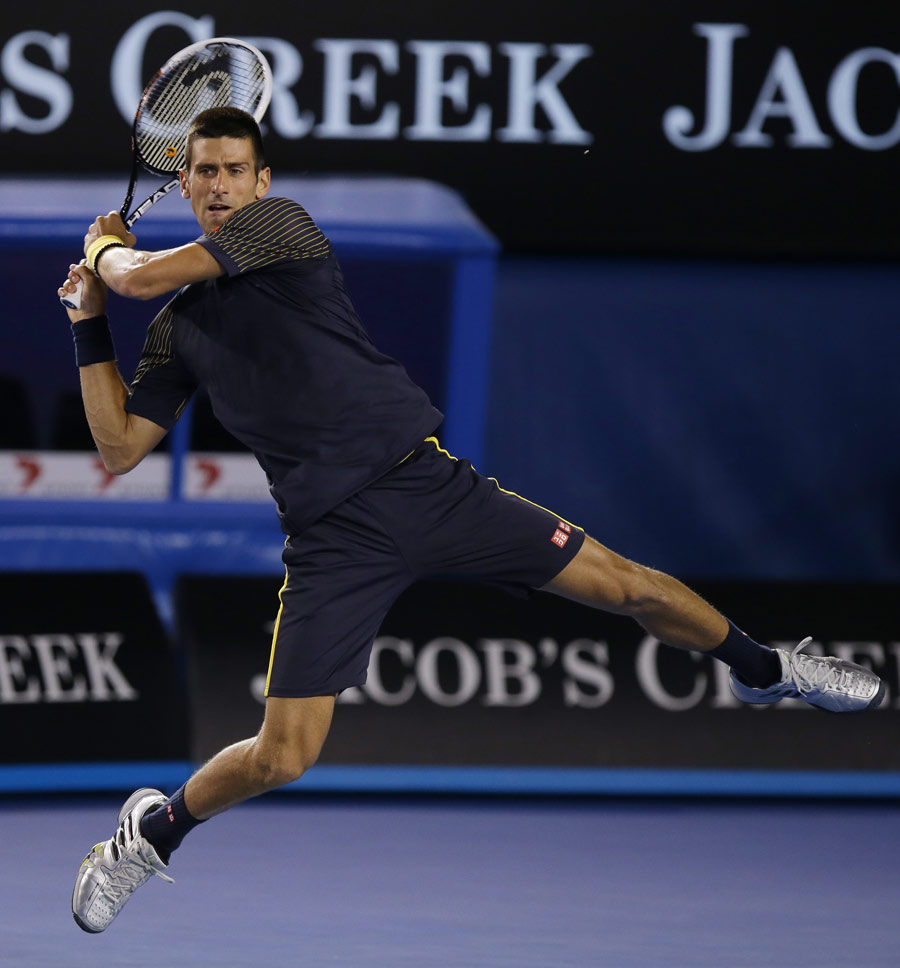 Novak Djokovic hits a backhand