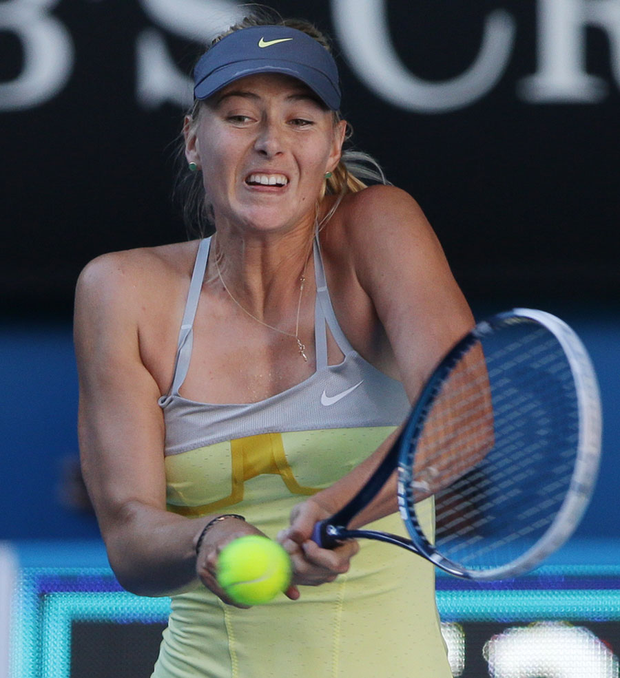 Maria Sharapova hits a return to Ekaterina Makarova