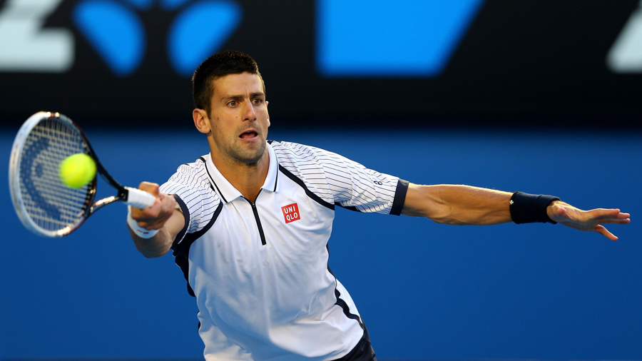 Novak Djokovic stretches for a return
