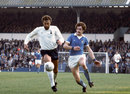 Tottenham Hotspur's Martin Chivers holds off Manchester City's Kenny Clements