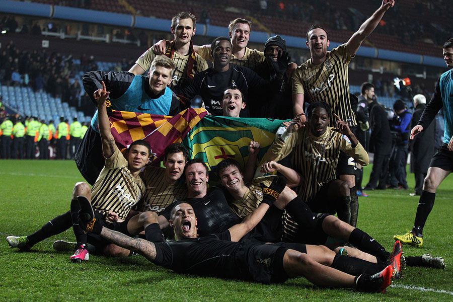 Bradford City's players celebrate after beating Aston Villa on aggregate to make the final